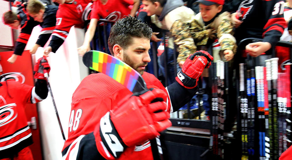 Carolina’s Jordan Martinook rocks some rainbow tape on his blade to honour Pride Night on Sunday in North Carolina. (Photo by Gregg Forwerck/NHLI via Getty Images)