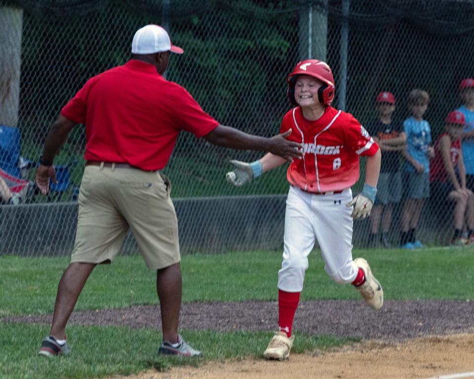 Holbrook Dylan Johnson celebrates as he hits a three run homer in the fourth inning. Holbrook Little League defeats Lincroft 5-0 in Sectional Tournament in Yardville, NJ on July 14, 2023. 