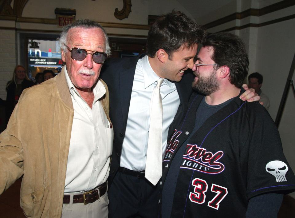 Executive Producer Stan Lee, from left, with cast members Ben Affleck and Kevin Smith pose in the lobby at the premiere of 