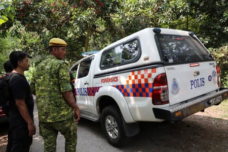 A police forensic vehicle enters the Dusun Resort, where 15-year-old Irish girl Nora Anne Quoirin went missing in Seremban