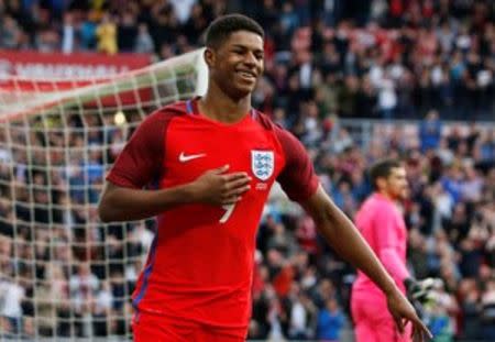 Marcus Rashford celebrates after scoring the first goal for England. Action Images via Reuters / Ed Sykes