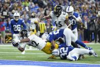 Pittsburgh Steelers' Najee Harris (22) dives in for a touchdown against Indianapolis Colts' Julian Blackmon (32) and Kenny Moore II (23) during the first half of an NFL football game, Monday, Nov. 28, 2022, in Indianapolis. (AP Photo/AJ Mast)