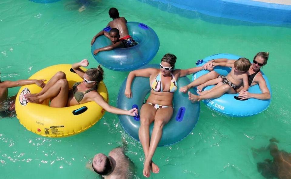 Visitors at Gulf Islands Water Park in Gulfport float down the Lazy Pearl River, which is longer than three football fields and carries people on tubes around all of the park’s attractions.