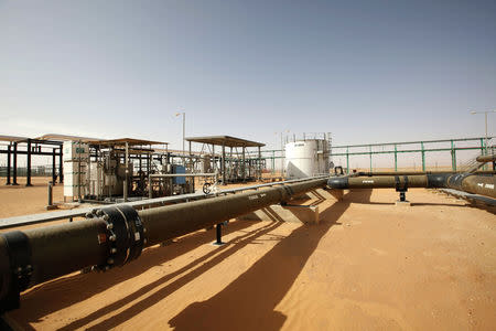 FILE PHOTO: Pipes are pictured at the El Sharara oilfield December 3, 2014. REUTERS/Ismail Zitouny/File Photo