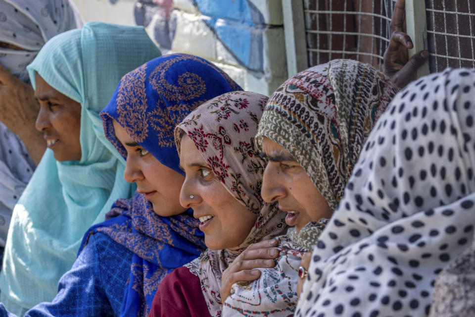 Kashmiri village women queue up to vote outside a polling booth during the fifth round of multi-phase national election in Sephora village, west of Srinagar, Indian controlled Kashmir, Monday, May 20, 2024. (AP Photo/Dar Yasin)