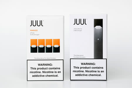 An electronic cigarette device made by JUUL (R) and its vaping pods are shown in this picture illustration taken September 14, 2018. REUTERS/Mike Blake/Illustration