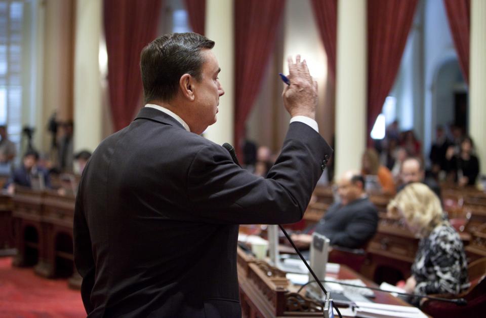 Sen. Joel Anderson, R-Alpine, speaks against a resolution to suspend three Democrats who face charges in criminal cases on the floor of the Senate in Sacramento, Calif., on Friday, March 28, 2014. The resolution which passed 28-1 prevents Democratic Sens. Ron Calderon, Leland Yee and Rod Wright from exercising any power of their office until the pending criminal cases against them have been resolved.(AP Photo/Steve Yeater)