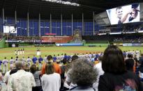 <p>A video is played in honor of pitcher Jose Fernandez (16) during a pre-game ceremony before a baseball game between the Miami Marlins and New York Mets, Monday, Sept. 26, 2016, in Miami. Fernandez died in a boating accident Sunday. (AP Photo/Lynne Sladky) </p>