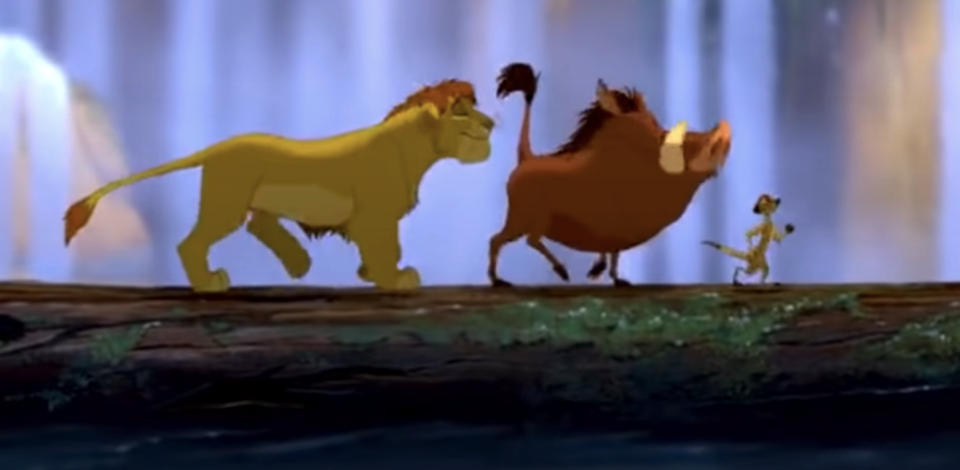 Simba, Pumbaa, and Timon walking on a log