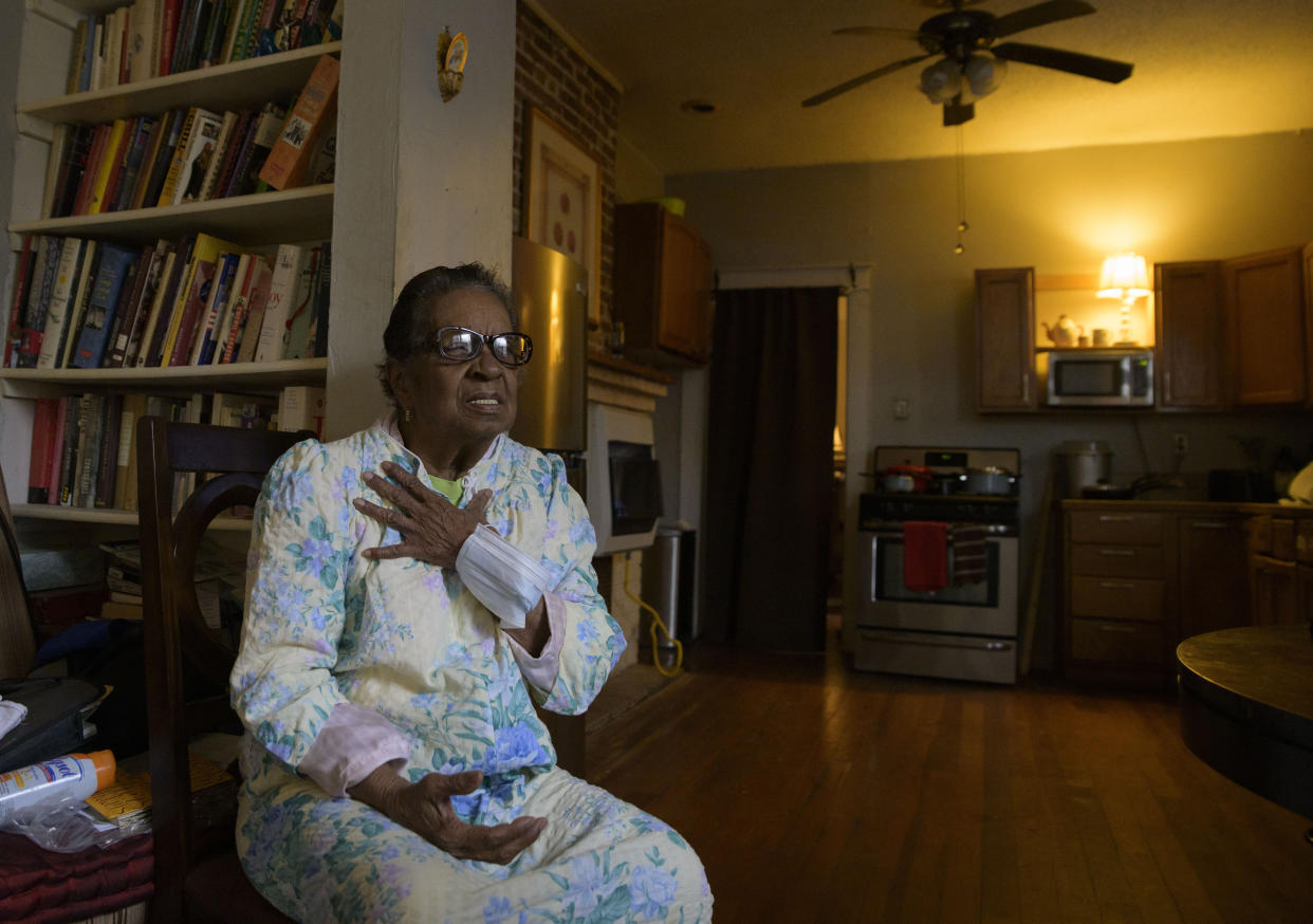Carolyn Peters sits in her home in New Orleans, Friday, Feb. 4, 2022. Peters, who lives on a low fixed income, has high utility bills including late fees from Entergy, a major utility provider in Louisiana and three other Southern states. When asked about how she was planning to pay her outstanding bill, Peters said she would have to give up another necessity like medication. "It’s a strain,” she said. (AP Photo/Matthew Hinton)