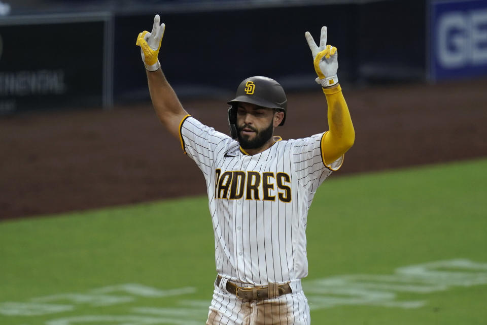 San Diego Padres' Eric Hosmer reacts after hitting a grand slam during the fifth inning of a baseball game against the Texas Rangers, Thursday, Aug. 20, 2020, in San Diego. (AP Photo/Gregory Bull)