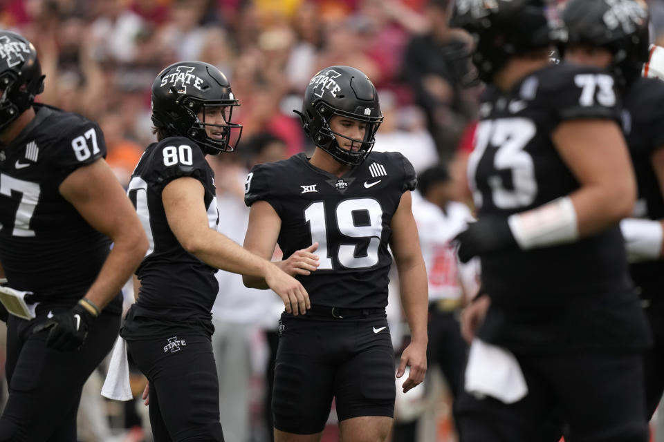 Iowa State place-kicker Chase Contreraz (19) celebrates with teammates after kicking a 46-yard field goal during the first half of an NCAA college football game against Oklahoma State, Saturday, Sept. 23, 2023, in Ames, Iowa. (AP Photo/Charlie Neibergall)