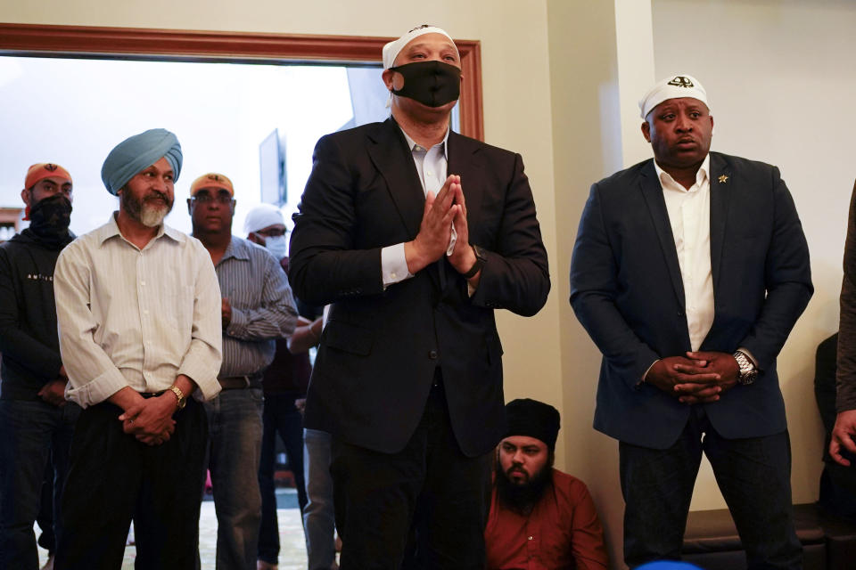 Rep. Andre Carson, D-Ind., speaks with members of the Sikh Coalition at the Sikh Satsang of Indianapolis in Indianapolis, Saturday, April 17, 2021 for a commemoration of the victims of the shooting at a FedEx facility in Indianapolis that claimed the lives of several members of the Sikh community. A gunman killed and wounded several people before taking his own life in a late-night attack at a FedEx facility near the Indianapolis airport. (AP Photo/AJ Mast)