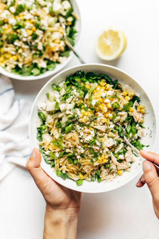 <p>Pinch of Yum</p><p>Chock full of chicken and orzo, loaded with fresh veggies, and finished with a zippy lemon dressing and goat cheese, this salad is a complete meal.</p><p><strong>Recipe here: </strong><strong><a href="http://pinchofyum.com/zippy-orzo-summer-salad" rel="nofollow noopener" target="_blank" data-ylk="slk:Orzo Summer Salad;elm:context_link;itc:0;sec:content-canvas" class="link ">Orzo Summer Salad</a></strong></p>