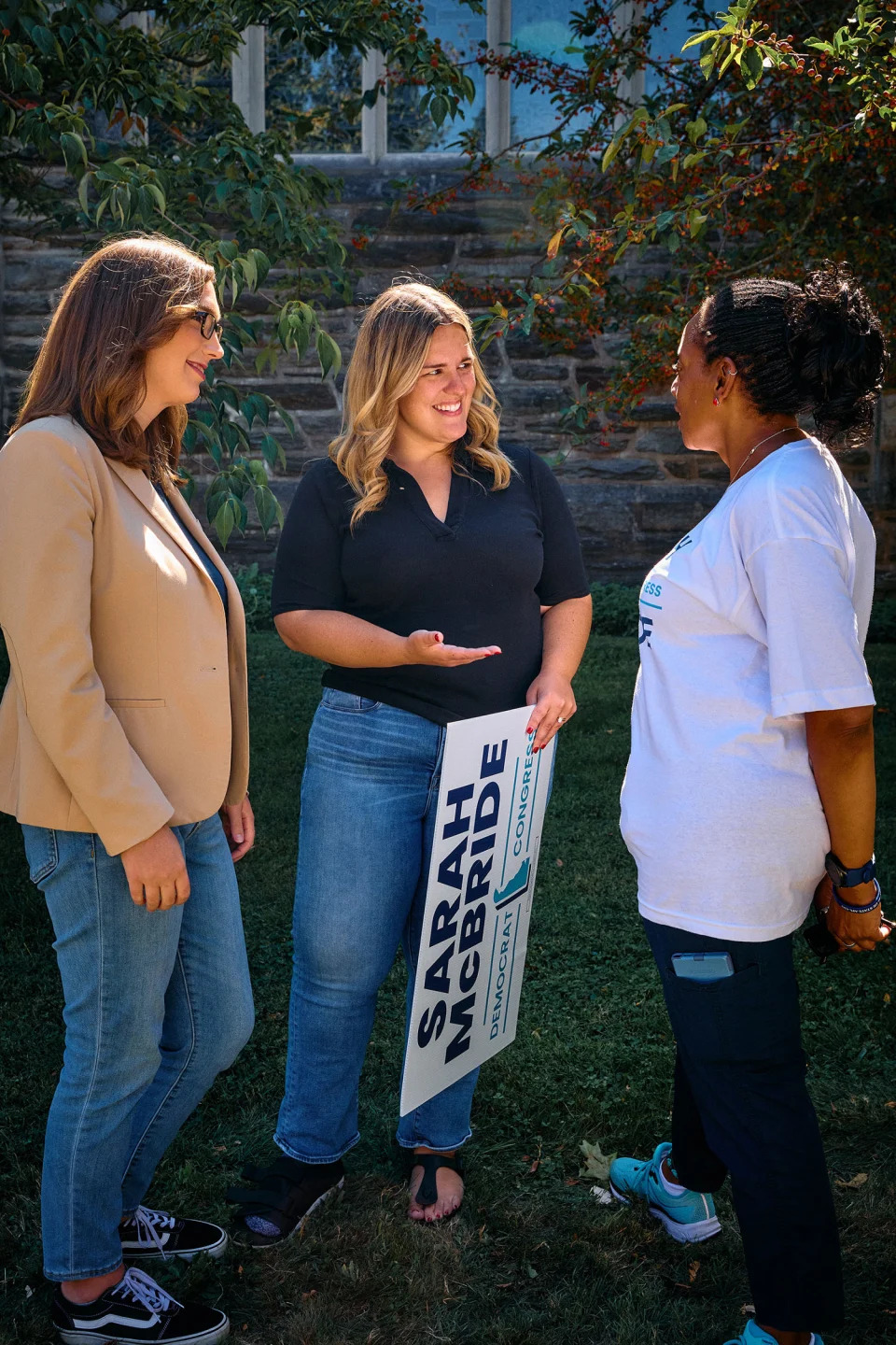 Taylor Hawk and McBride speak to a supporter (Jana Williams for NBC News)