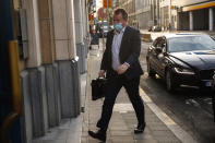 Britain's chief negotiator David Frost arrives to the UK delegation after a meeting with European Commission's Head of Task Force for Relations with the United Kingdom Michel Barnier in Brussels, Sunday, Dec. 13, 2020. Facing yet another self-imposed Brexit deadline on Sunday, the chief negotiators from the European Union and United Kingdom were making last-ditch efforts to scale differences on a trade deal that have proved insurmountable for the best part of the year. (AP photo/Francisco Seco)