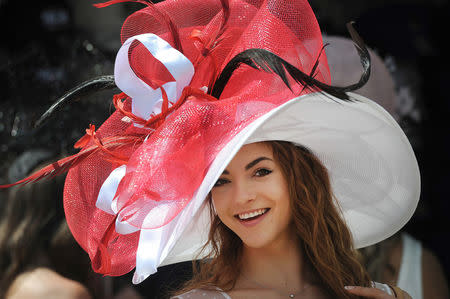 Monique Rosteing poses with her derby hat before the 142nd running of the Kentucky Derby at Churchill Downs. Mandatory Credit: David Lee Hartlage/Louisville Courier-Journal