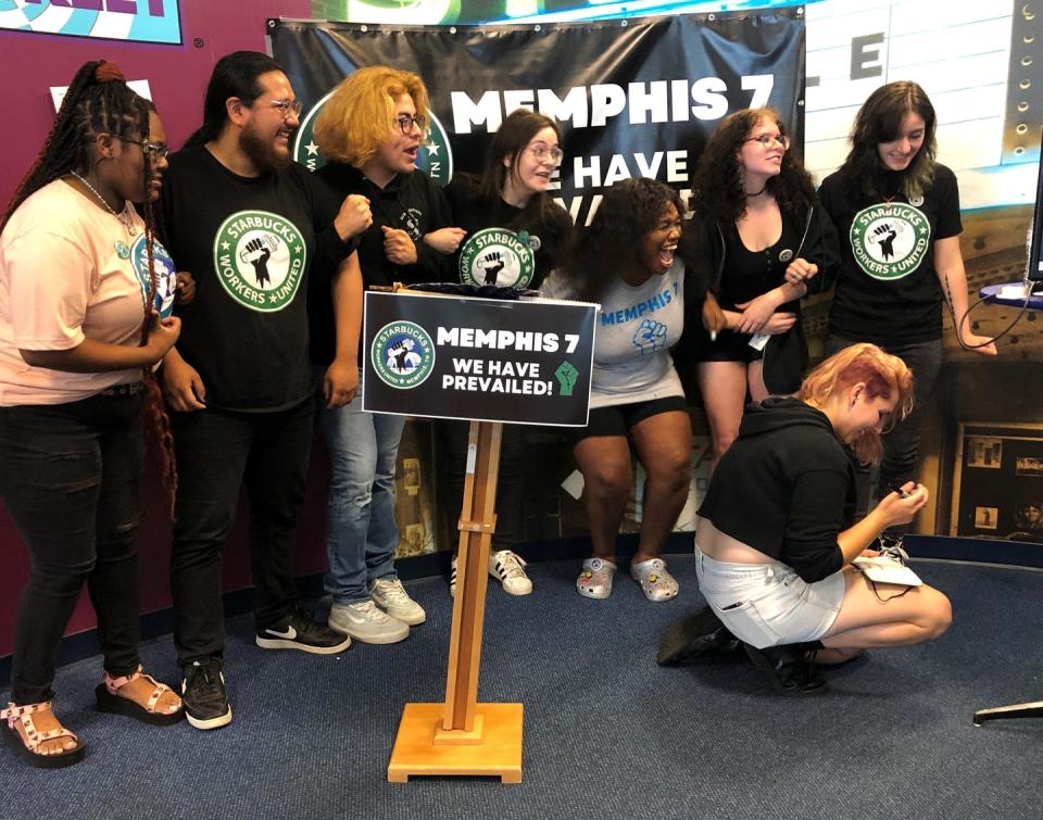 <span class="caption">A group of fired Starbucks employees celebrate the result of a vote to unionize one of the coffee company’s locations on June 7, 2022, in Memphis, Tenn. Starbucks says the ex-employees were fired for violating company policies, but the so-called Memphis Seven say they were let go in retaliation for unionization efforts.</span> <span class="attribution"><a class="link " href="https://newsroom.ap.org/detail/Starbucks-Union/72f34bea87f24b39a3ba0a237e28cad3/photo?Query=starbucks&mediaType=photo&sortBy=arrivaldatetime:desc&dateRange=Anytime&totalCount=2629&currentItemNo=0" rel="nofollow noopener" target="_blank" data-ylk="slk:AP Photo/Adrian Sainz;elm:context_link;itc:0;sec:content-canvas">AP Photo/Adrian Sainz</a></span>