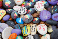 <p>Stones with messages for the victims and survivors are piled outside the Pulse Nightclub on the one year anniversary of the shooting, in Orlando, Florida, U.S., June 12, 2017. (REUTERS/Scott Audette) </p>