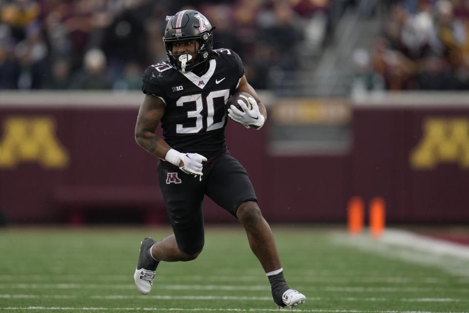 Minnesota running back Jordan Nubin (30) runs with the ball during the second half of an NCAA college football game against Michigan State, Saturday, Oct. 28, 2023, in Minneapolis. (AP Photo/Abbie Parr)