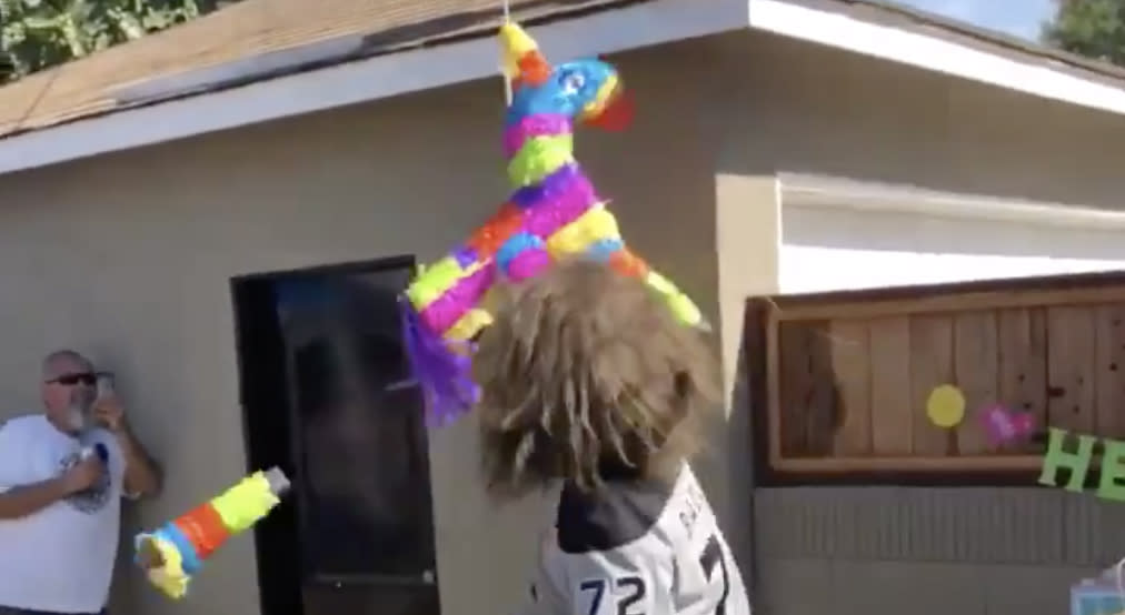 Bailey had to bust through a piñata that was seemingly made of concrete and Kevlar in order to complete his mission. (Twitter//@BaileyLAKings)