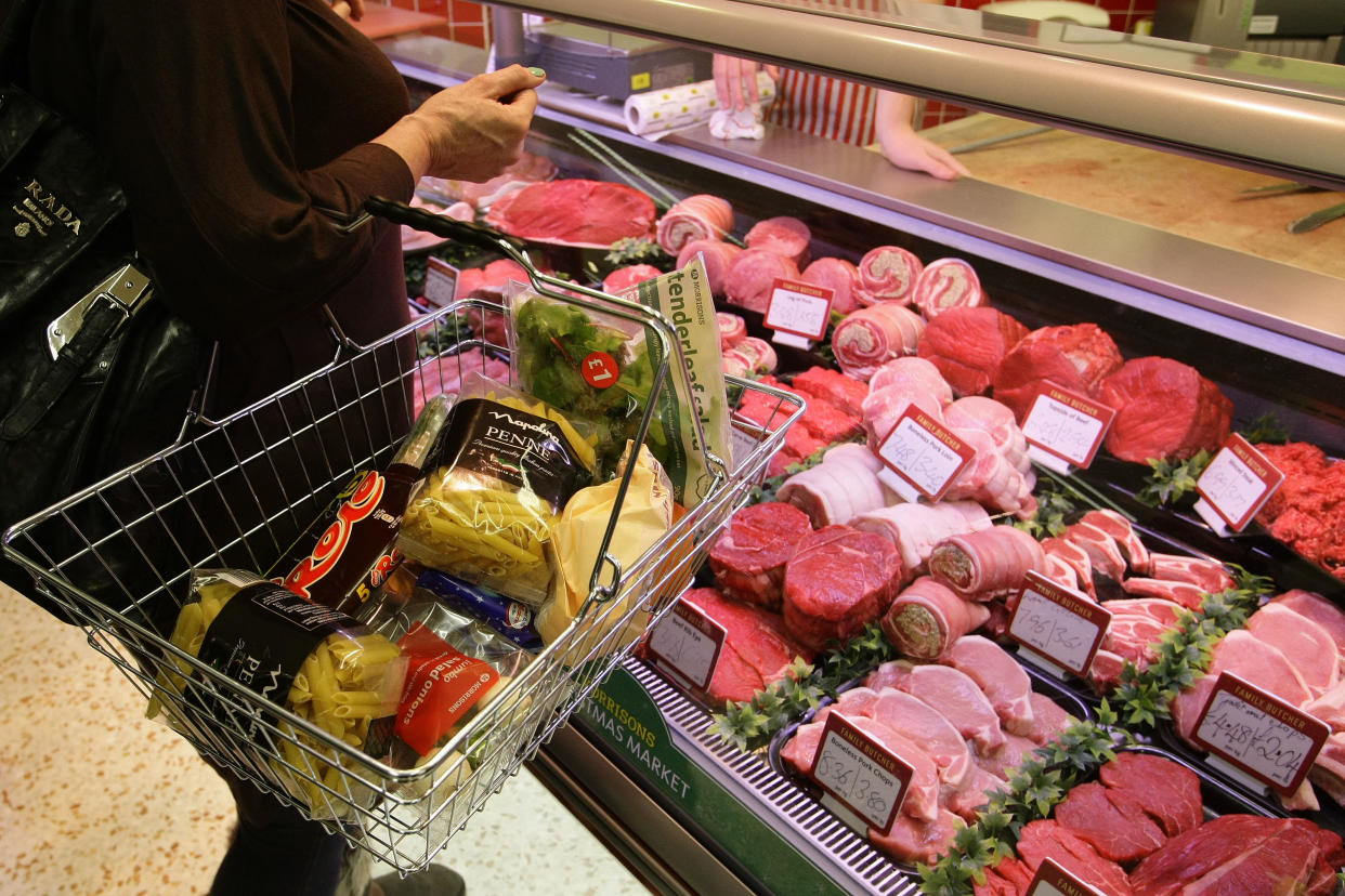 inflation: A customer shops at a supermarket