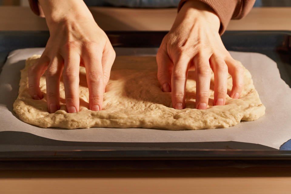 Kneading focaccia dough.
