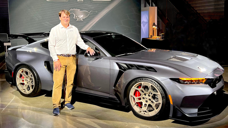 Jim Farley, Ford's president and CEO, stands alongside the Ford Mustang GTD supercar. 