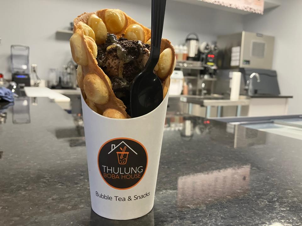 A bubble waffle filled with chocolate ice cream, Oreo crumbs and caramel drizzle at Thulung Boba House in downtown Cuyahoga Falls.