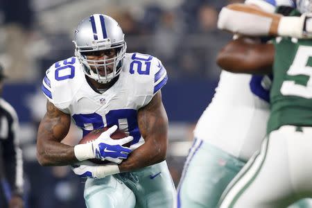 Dec 19, 2015; Arlington, TX, USA; Dallas Cowboys running back Darren McFadden (20) runs the ball in the first half against the New York Jets at AT&T Stadium. New York won 19-16. Mandatory Credit: Tim Heitman-USA TODAY Sports