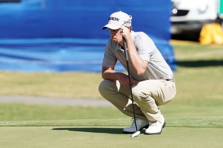 Jan 10, 2019; Honolulu, HI, USA; PGA golfer Andrew Putnam lines up a putt on the 18th hole during the first round of the Sony Open in Hawaii golf tournament at Waialae Country Club. Mandatory Credit: Brian Spurlock-USA TODAY Sports