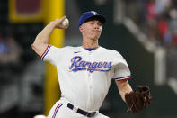 Texas Rangers starting pitcher Glenn Otto throws during the first inning of a baseball game against the Boston Red Sox in Arlington, Texas, Saturday, May 14, 2022. (AP Photo/LM Otero)