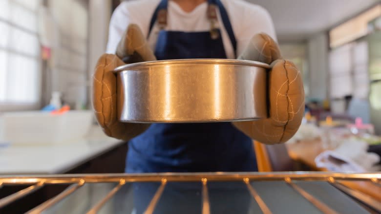 removing cake pan from oven