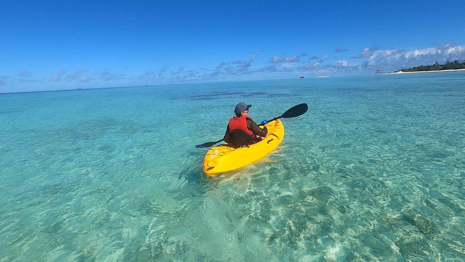 Woman canoeing at the Pullman resort in the Maldives