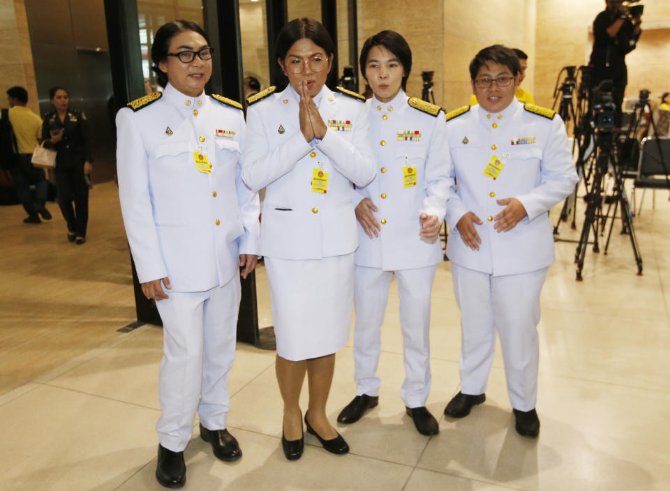 Member of parliament from Future Forward Party openly LGBT from left to right Tunyawaj Kamolwongwat, Tanwarin Sukkhapisit, Nateepat Kulsetthasith, Kawinnath Takey, arrive parliament in Bangkok, Thailand, Friday, May 24, 2019. Thailand's King Maha Vajiralongkorn plans to officially open parliament following the first democratic election since a coup five years ago. (AP Photo/Sakchai Lalit)