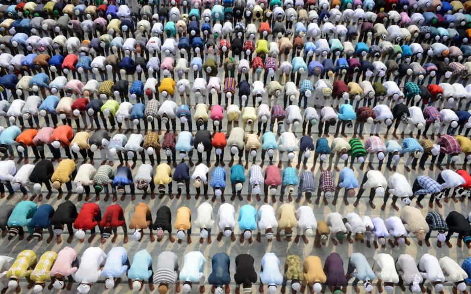 Indian Muslims offer Eid al-Adha prayers (the feast of sacrifice), the second of two Islamic holidays marking the end of the annual pilgrimage to the Saudi holy city of Mecca  - AFP