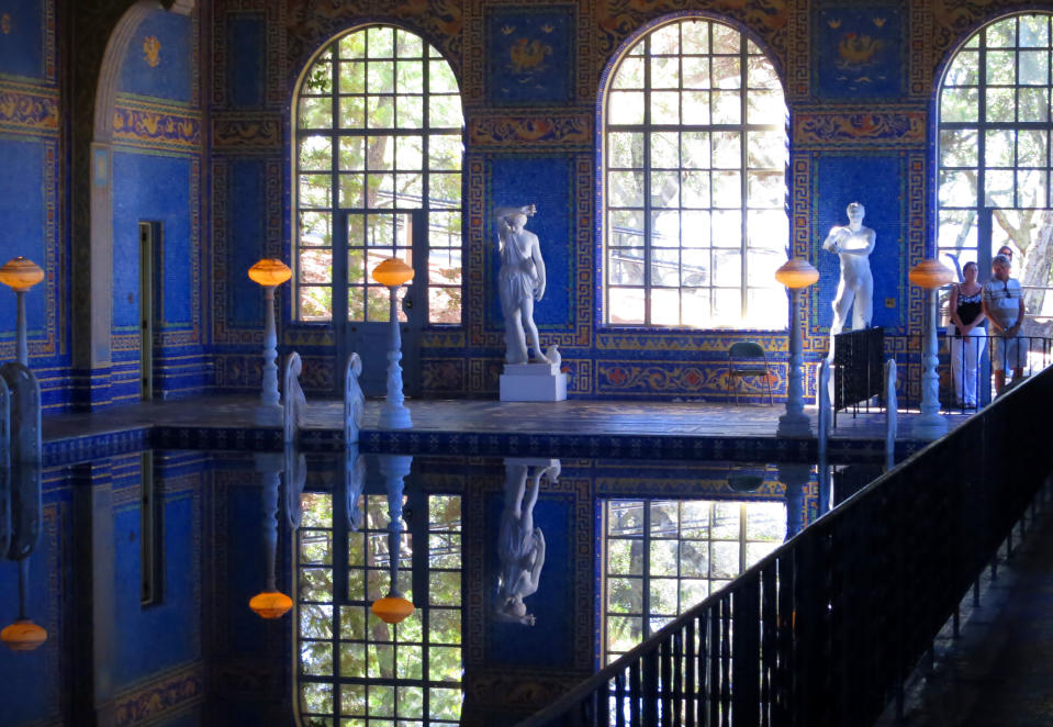 This Aug. 30, 2013 photo shows the blue-tiled, indoor Roman pool at the Hearst Castle in San Simeon, Calif. Newspaper publisher William Randolph Hearst's 165-room estate, which he called "La Cuesta Encantada" ("The Enchanted Hill"), overlooks the Pacific Ocean. (AP Photo/Jim MacMillan)