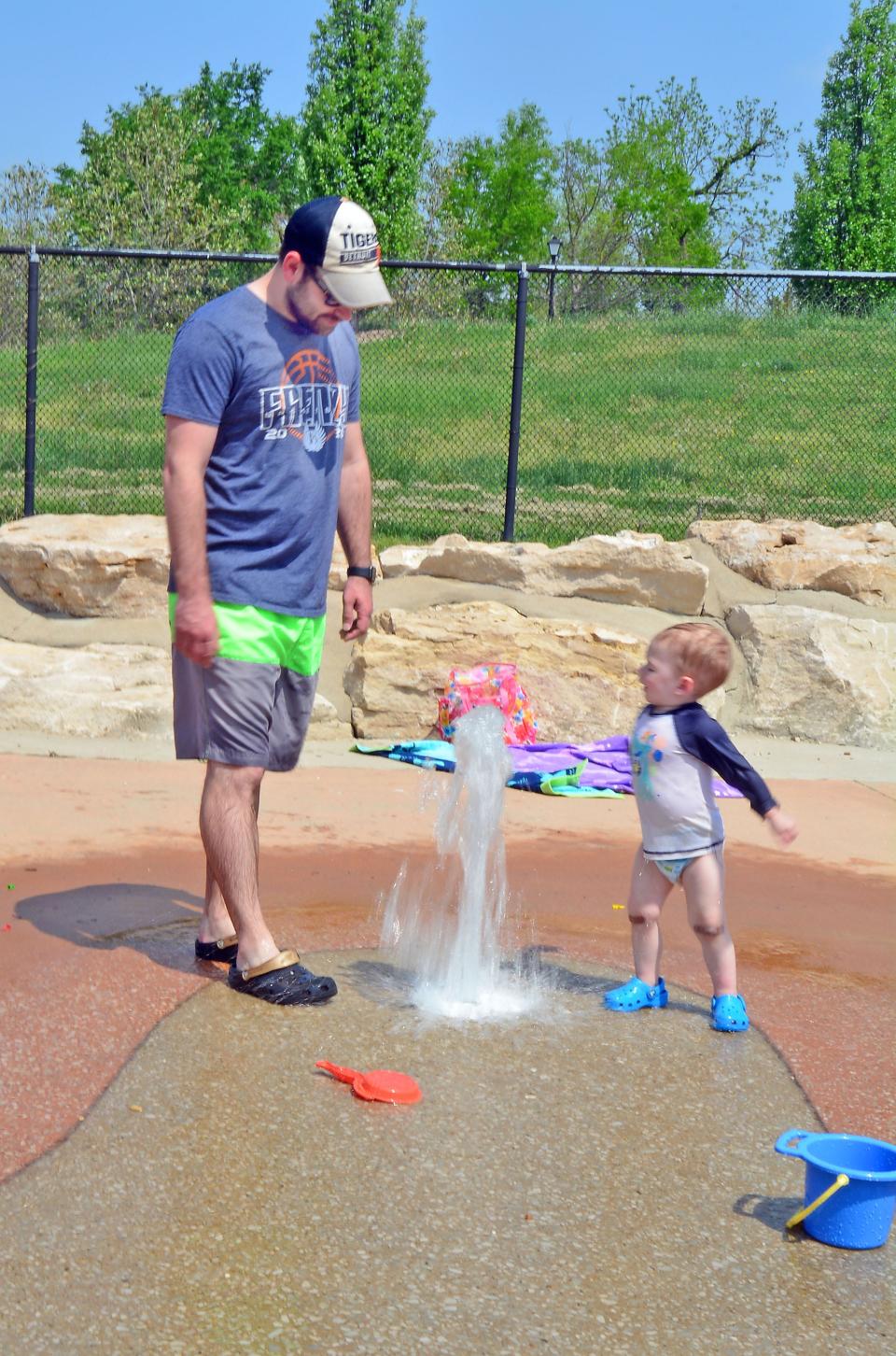 Jarom McLiver, left, and Jameson McLiver cool down last May at the splash pad at Stephens Lake Park.