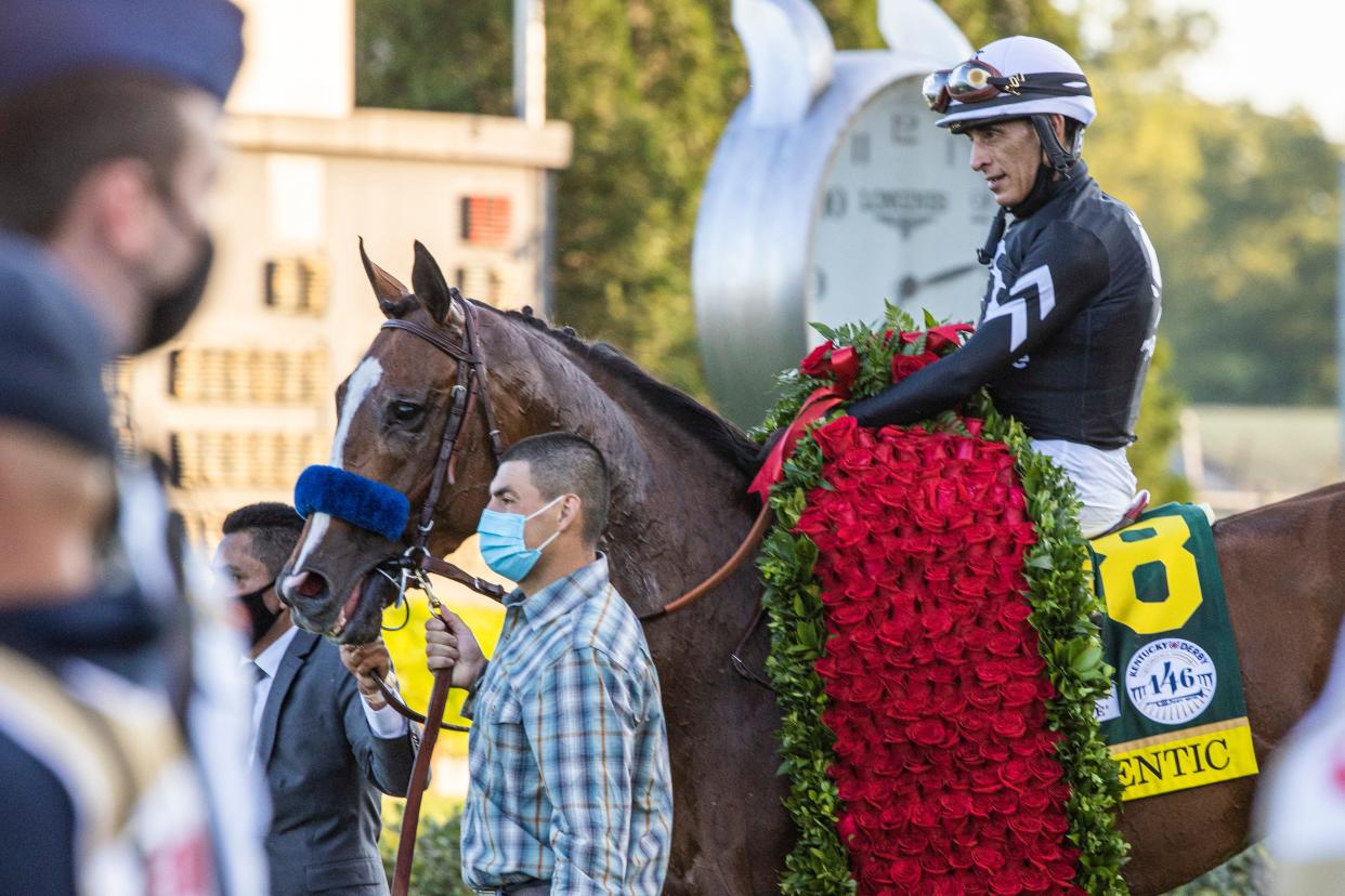 Authentic and jockey John Velazquez are draped with the garland of roses after winning the 146th Kentucky Derby. Sept. 5, 2020
