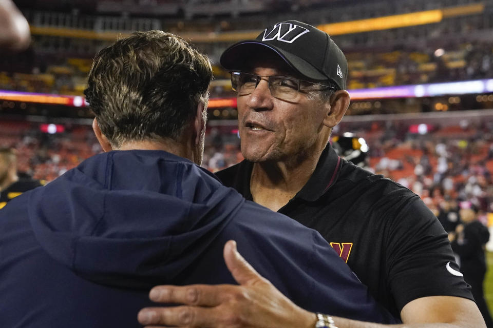 Chicago Bears head coach Matt Eberflus, left, and Washington Commanders head coach Ron Rivera, right, embrace on the field at the end of an NFL football game, Thursday, Oct. 5, 2023, in Landover, Md. Chicago won 40-20. (AP Photo/Alex Brandon)
