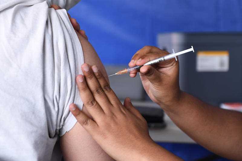 A patient receives a Covid-19 vaccination at a pop-up clinic at Bunnings Mt Gravatt in Brisbane.