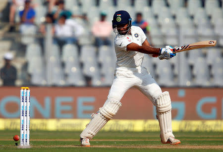 Fourth Test cricket match - Wankhede Stadium, Mumbai, India - 9/12/16. India's Cheteshwar Pujara plays a shot. REUTERS/Danish Siddiqui