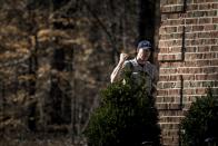 A Fairfax County police officer speaks with a local resident while on the hunt for accused bank robber Wossen Assaye, who escaped Inova Fairfax Hospital early Tuesday in Fairfax, Virginia March 31, 2015. The armed prisoner was on the run in a stolen car on Tuesday after escaping from the northern Virginia hospital where a shot was fired during a struggle with a guard, police said. Assaye, 42, broke free from a private security guard at the Inova Fairfax Medical Campus in Falls Church, Virginia, and fled with the guard's weapon, the Fairfax County Police Department said on its Twitter account. (REUTERS/James Lawler Duggan)