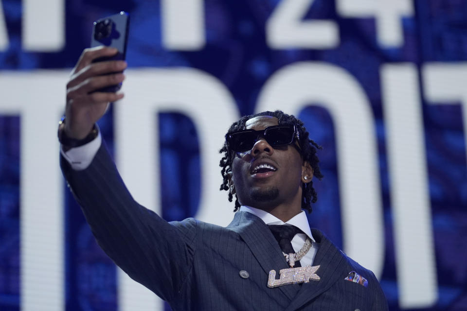 Toledo cornerback Quinyon Mitchell walks on stage during the first round of the NFL football draft, Thursday, April 25, 2024, in Detroit. (AP Photo/Jeff Roberson)