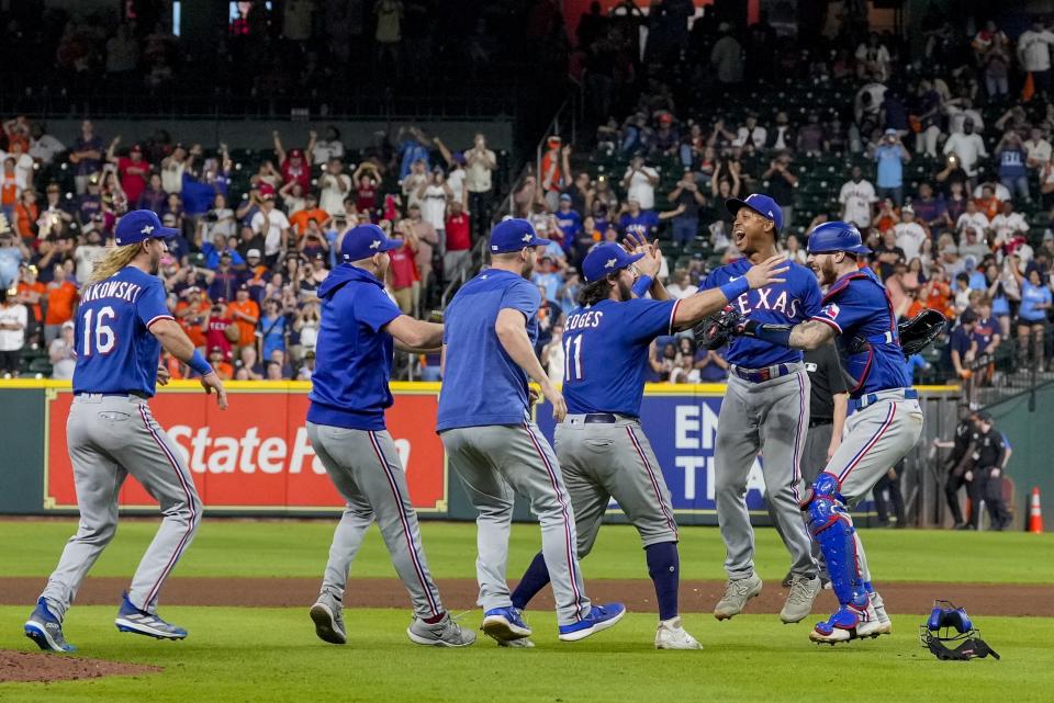 The Texas Rangers celebrate after Game 7 of the baseball AL Championship Series against the Houston Astros Monday, Oct. 23, 2023, in Houston. The Rangers won 11-4 to win the series 4-3. (AP Photo/Godofredo A. Vásquez)