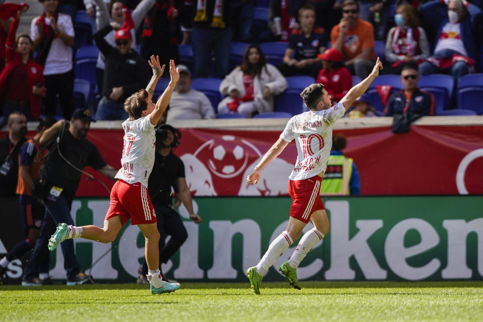 New York Red Bulls midfielder Lewis Morgan (10) celebrates his goal against the FC Cincinnati during the second half of an MLS soccer playoff game, Saturday, Oct. 15, 2022, in Harrison, N.J. (AP Photo/Eduardo Munoz Alvarez)