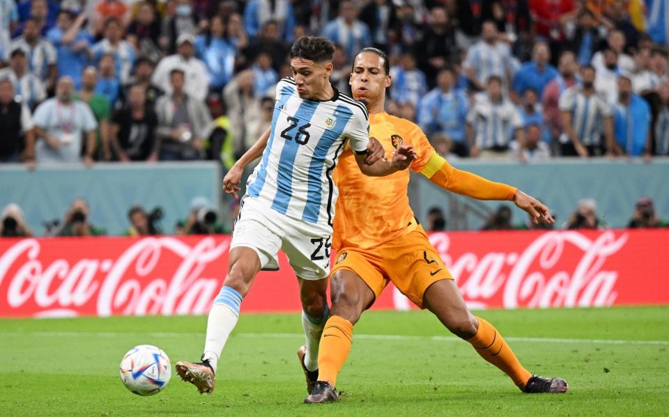 Nahuel Molina of Argentina scores the team's first goal during the FIFA World Cup Qatar 2022 quarter final match between Netherlands and Argentina - Matthias Hangst/Getty Images)