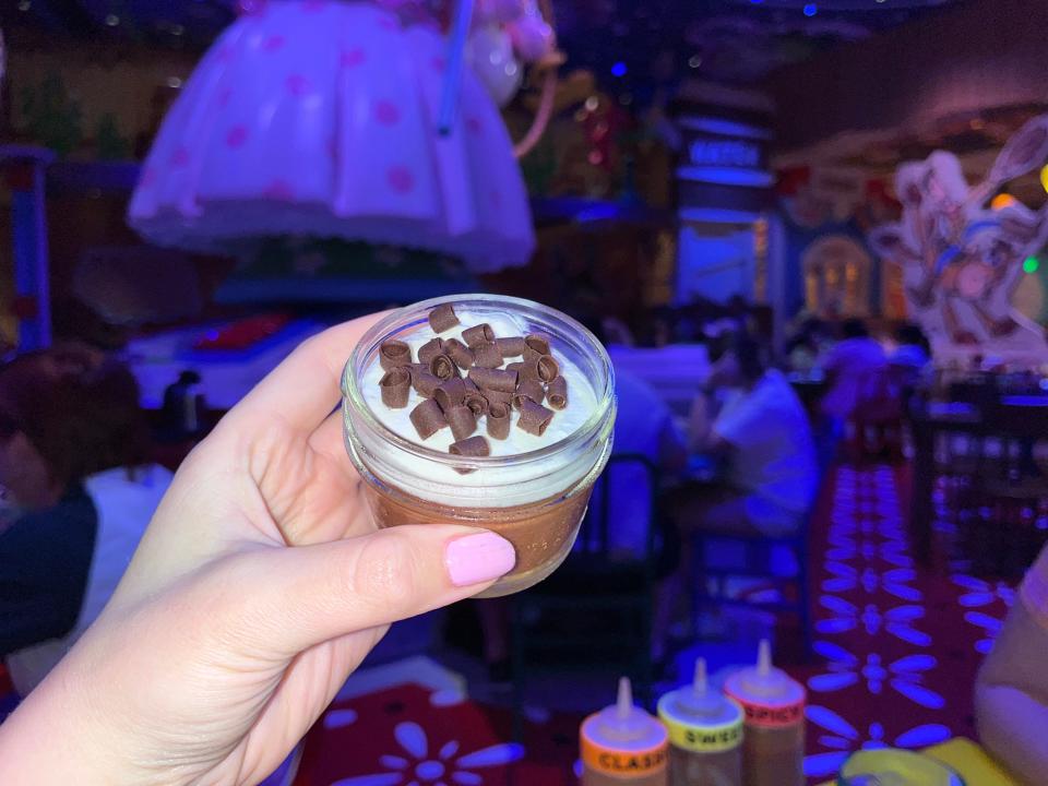 hand holding up chocolate pie dessert at roundup rodeo bbq in hollywood studios