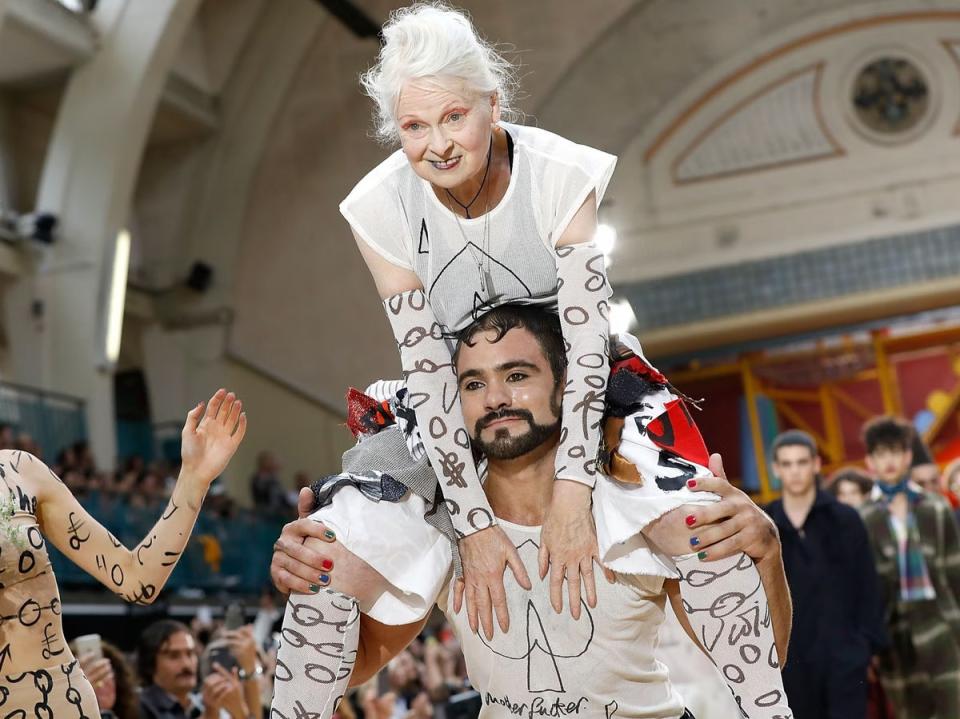 Westwood sits on a model’s shoulders during London Fashion Week in 2017 (Getty)
