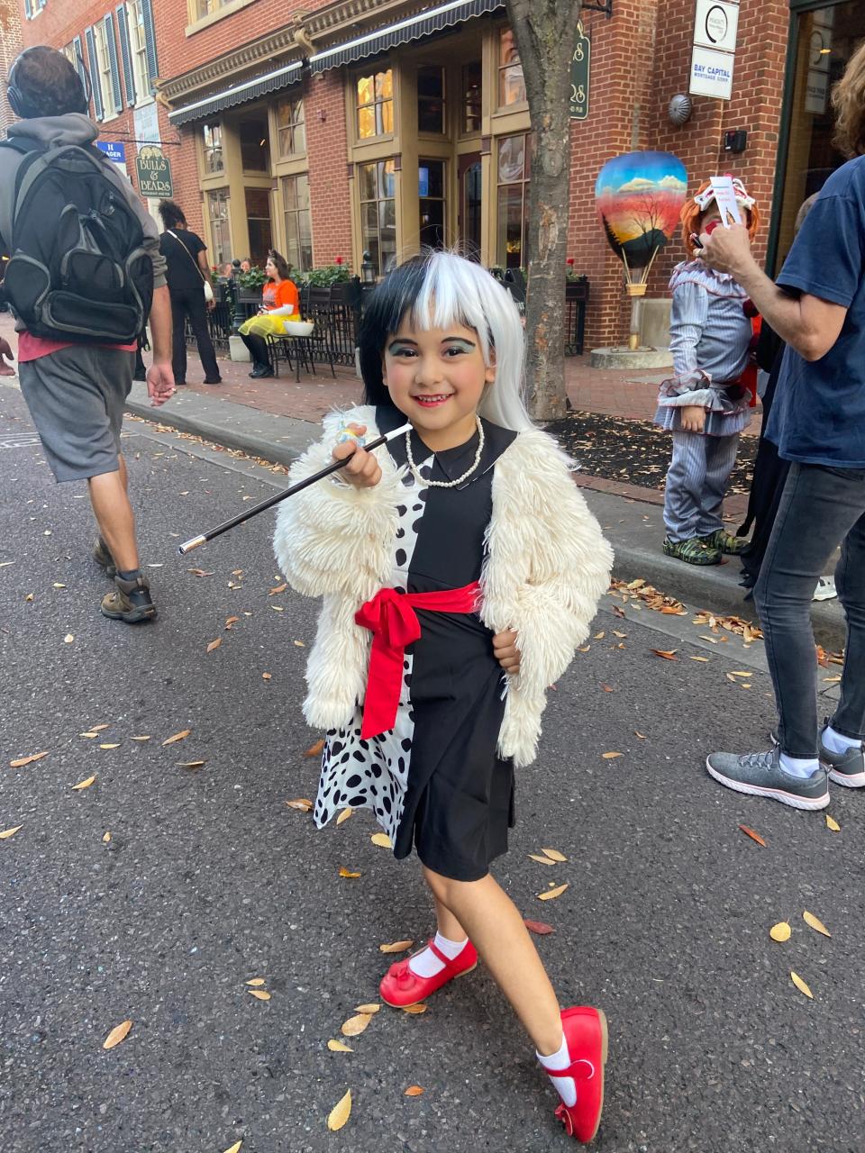 Layalani Giovanni is dressed as Cruella de Vil from the Disney movie "101 Dalmatians" during Friday's Halloween Block Party in downtown Hagerstown.